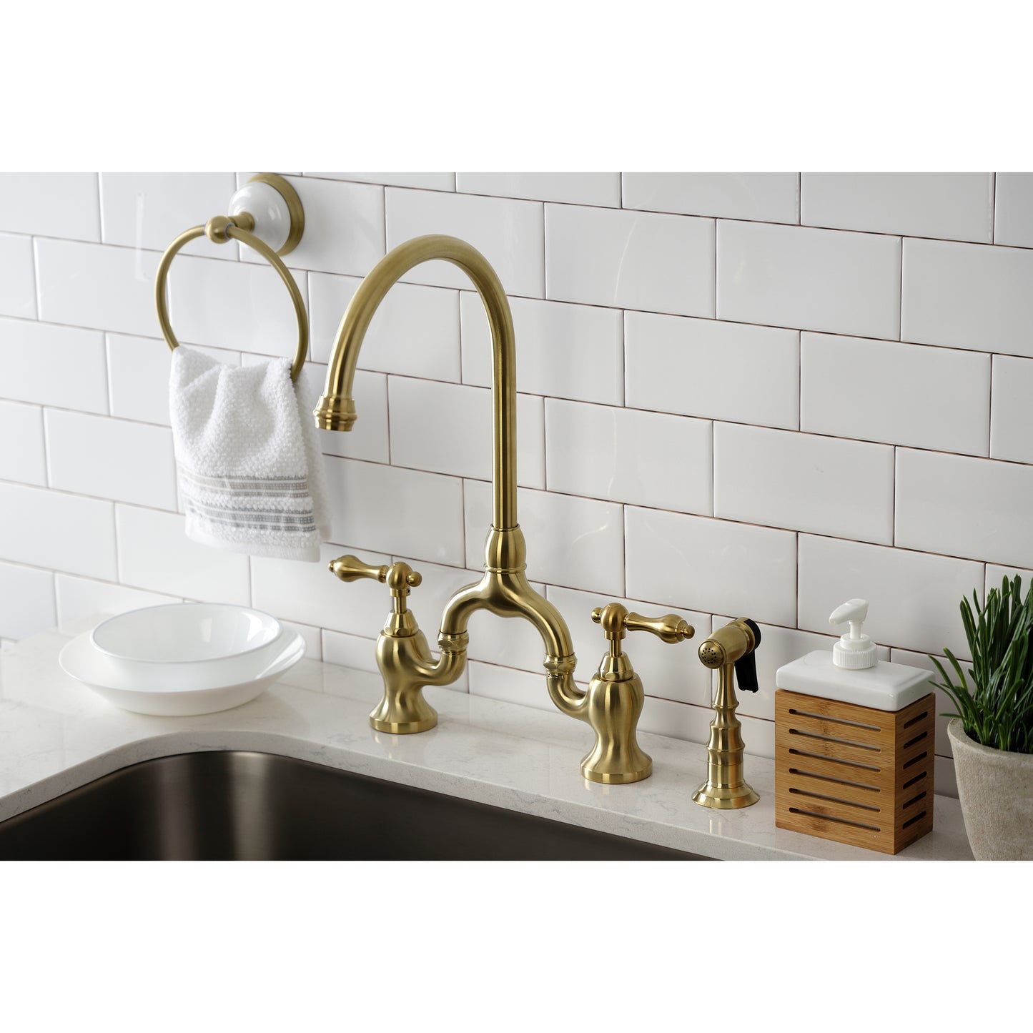 Kingston KS7793ALBS English Country Bridge Kitchen Faucet with Brass Sprayer, Antique Brass installed in kitchen