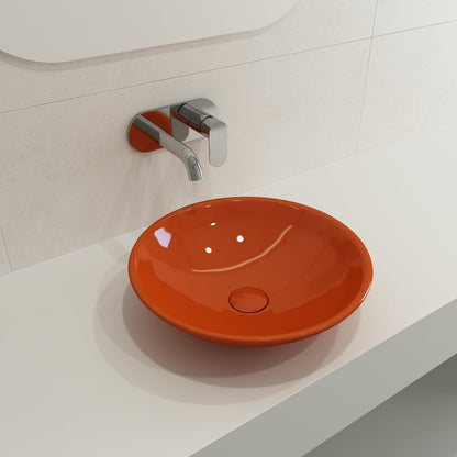 BOCCHI VENEZIA 15.75" Vessel Fireclay With Matching Drain Cover orange round sink on modern countertop.