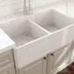 BOCCHI Classico 33" Fireclay Farmhouse Apron 50/50 Double Bowl Kitchen Sink showcasing dual-bowl design in a kitchen.