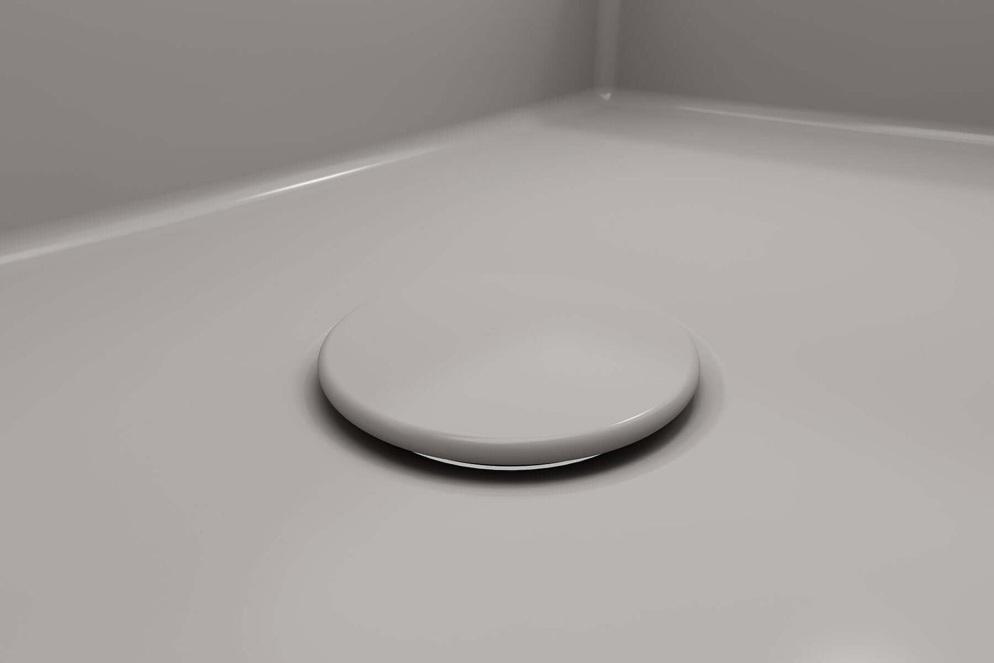 BOCCHI Drain Cover for Fireclay Kitchen Sink Strainers resting in a modern fireclay sink.