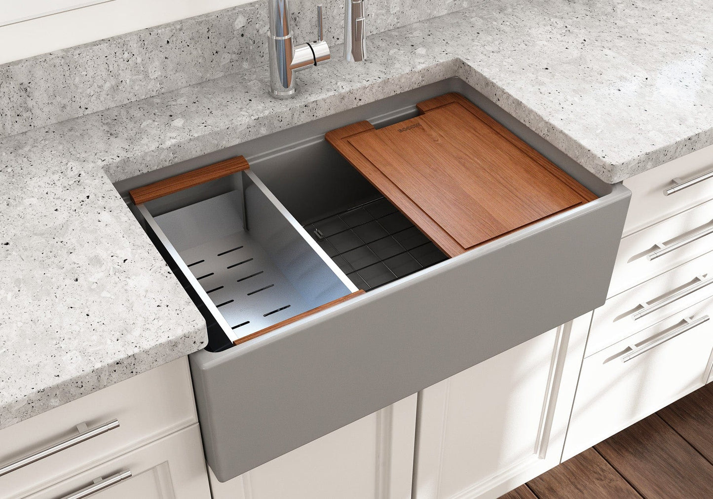 Lifestyle image of a matte gray Bocchi Contempo 30" sink in a modern kitchen with colander and cutting board in use.