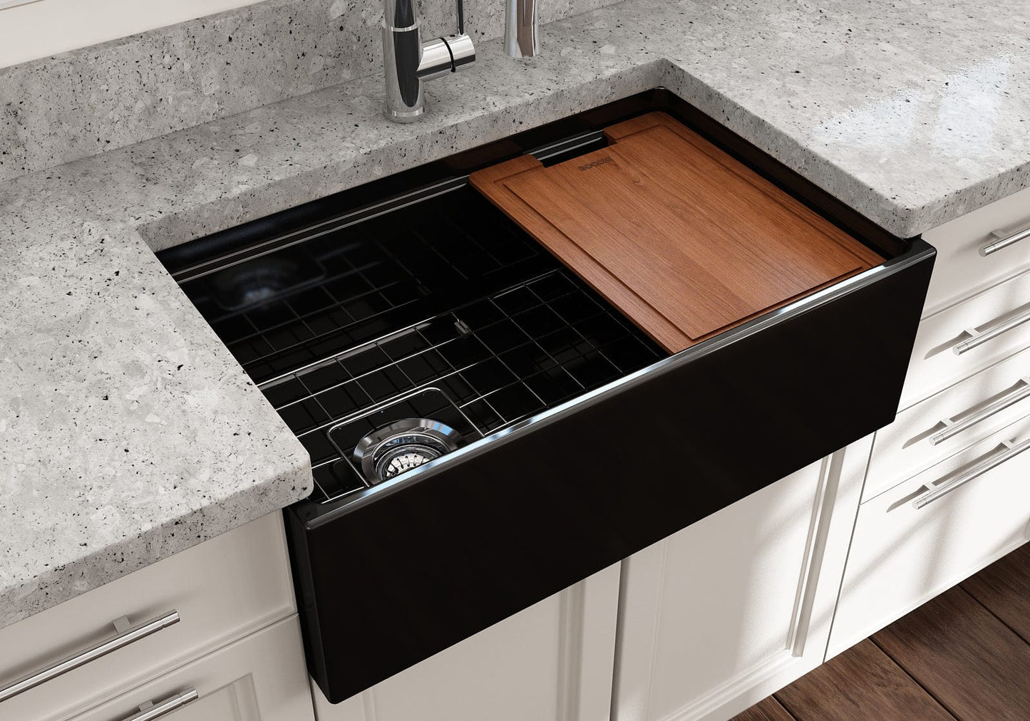 Lifestyle image of a black BOCCHI Contempo 30" sink in a modern kitchen with cutting board in use
