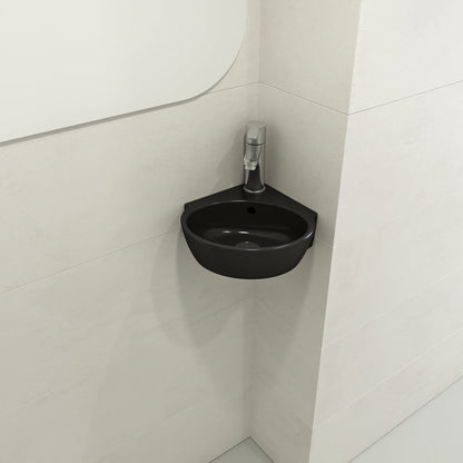 BOCCHI MILANO 12" Corner Sink Fireclay 1-Hole With Overflow in Matte Black, installed in a modern bathroom corner.