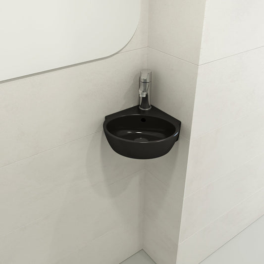 BOCCHI MILANO 12" Corner Sink Fireclay 1-Hole With Overflow in Matte Black, installed in a modern bathroom corner.