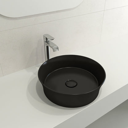 Left side view of BOCCHI SOTTILE 15" Round Vessel Fireclay with Matching Drain Cover in matte black on a white countertop.