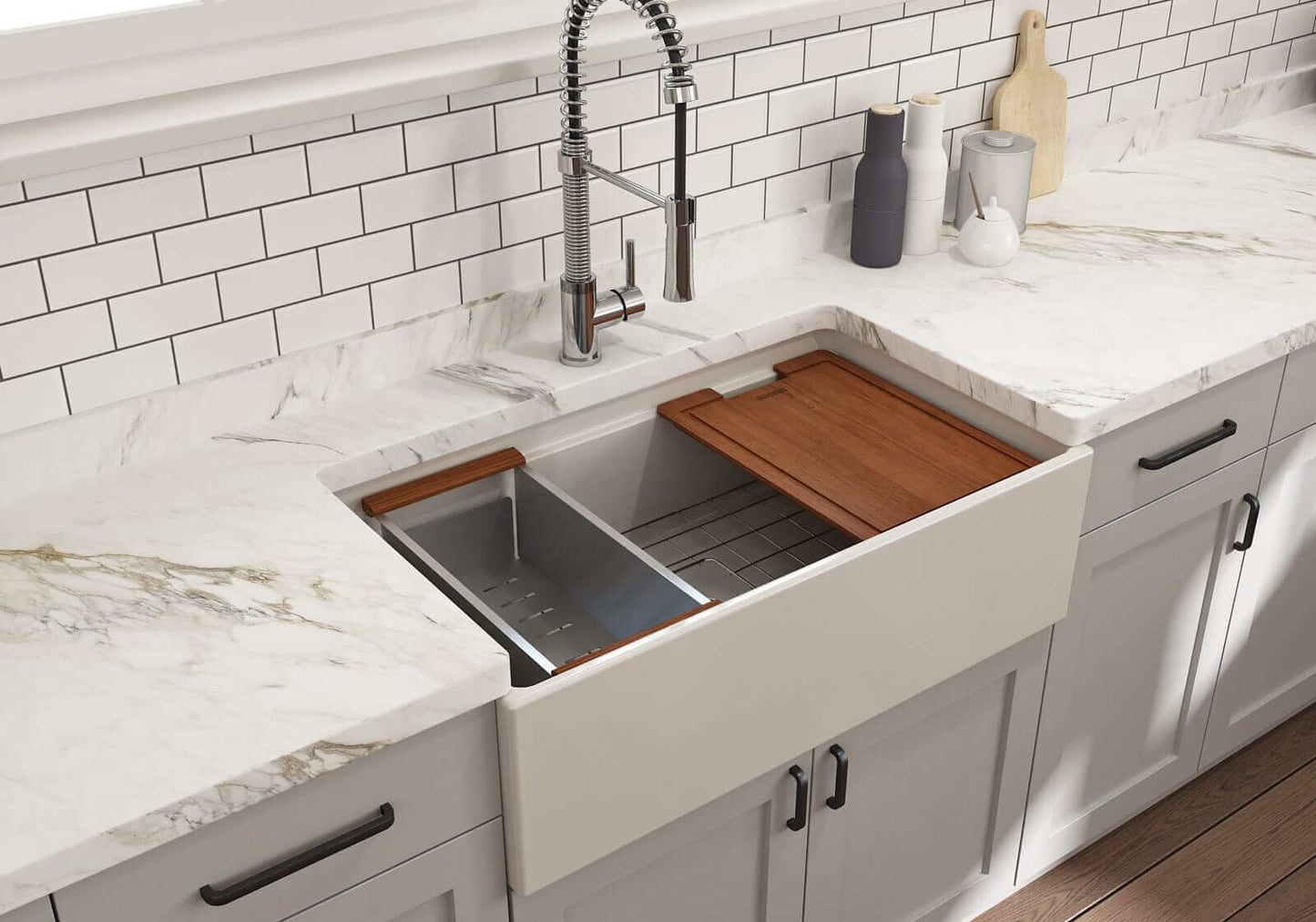 Lifestyle image of biscuit step-rim BOCCHI Contempo 33" sink in a modern kitchen with colander and cutting board in use.