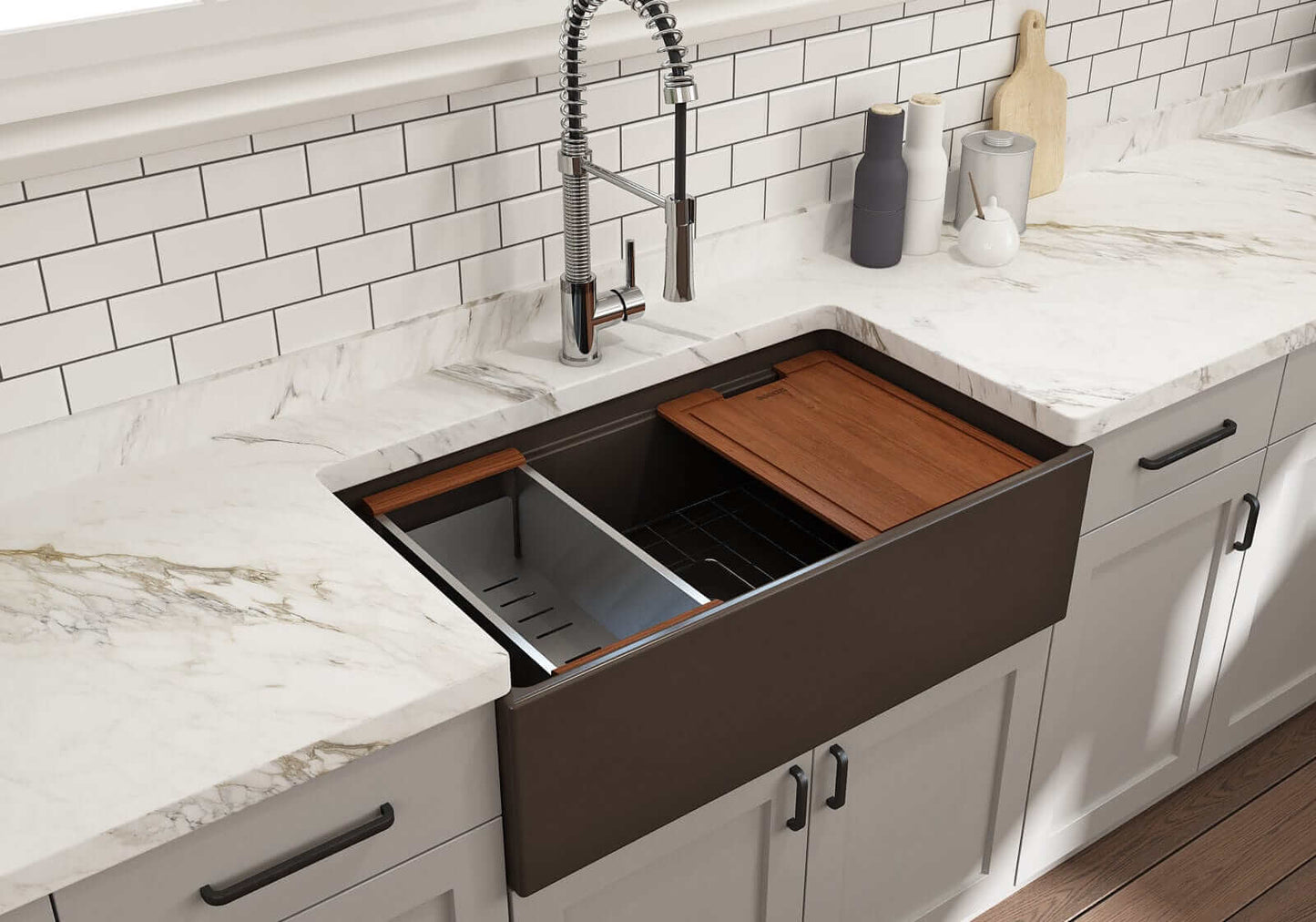 Lifestyle image of Matte Brown step-rim BOCCHI Contempo 33" sink in a modern kitchen with colander and cutting board in use.