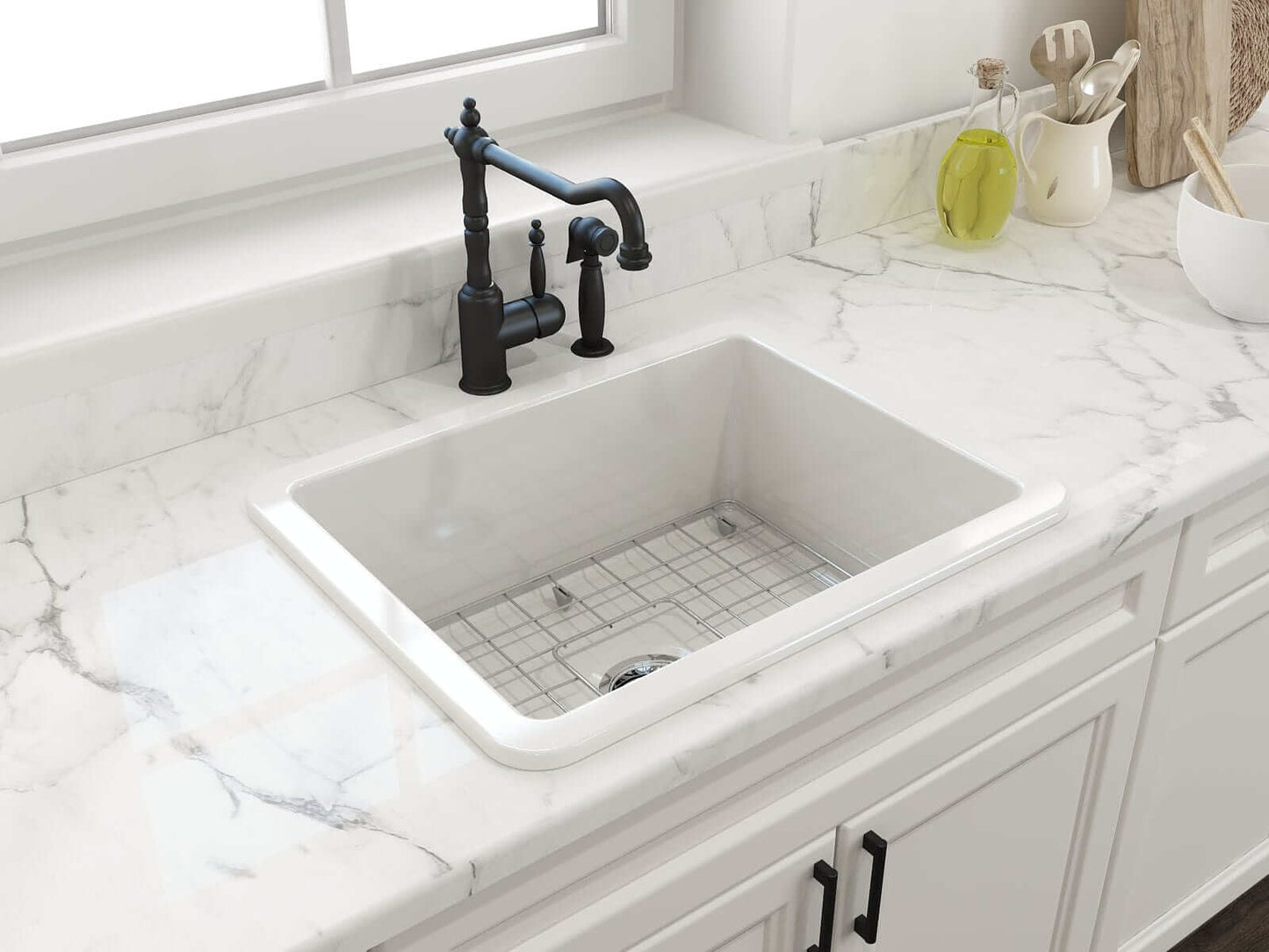 BOCCHI SOTTO 24" Fireclay Dual-Mount Single Bowl Sink with Bottom Grid & Strainer on a marble countertop with a black faucet.