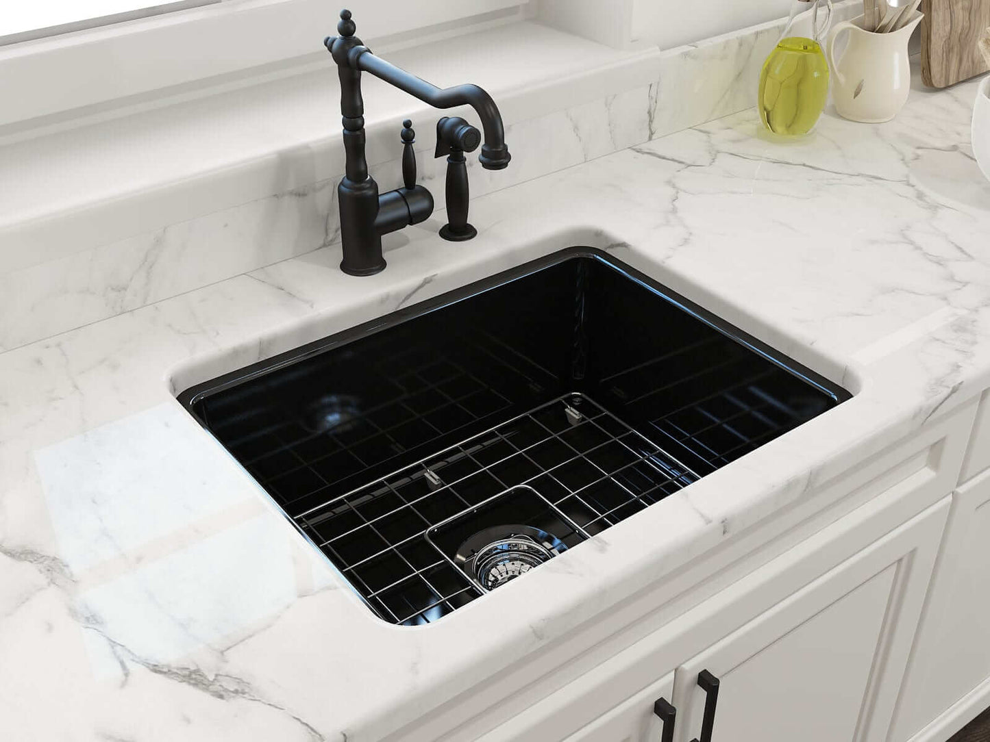 BOCCHI SOTTO 24" Fireclay Dual-Mount Single Bowl Sink with Bottom Grid & Strainer on white marble countertop.