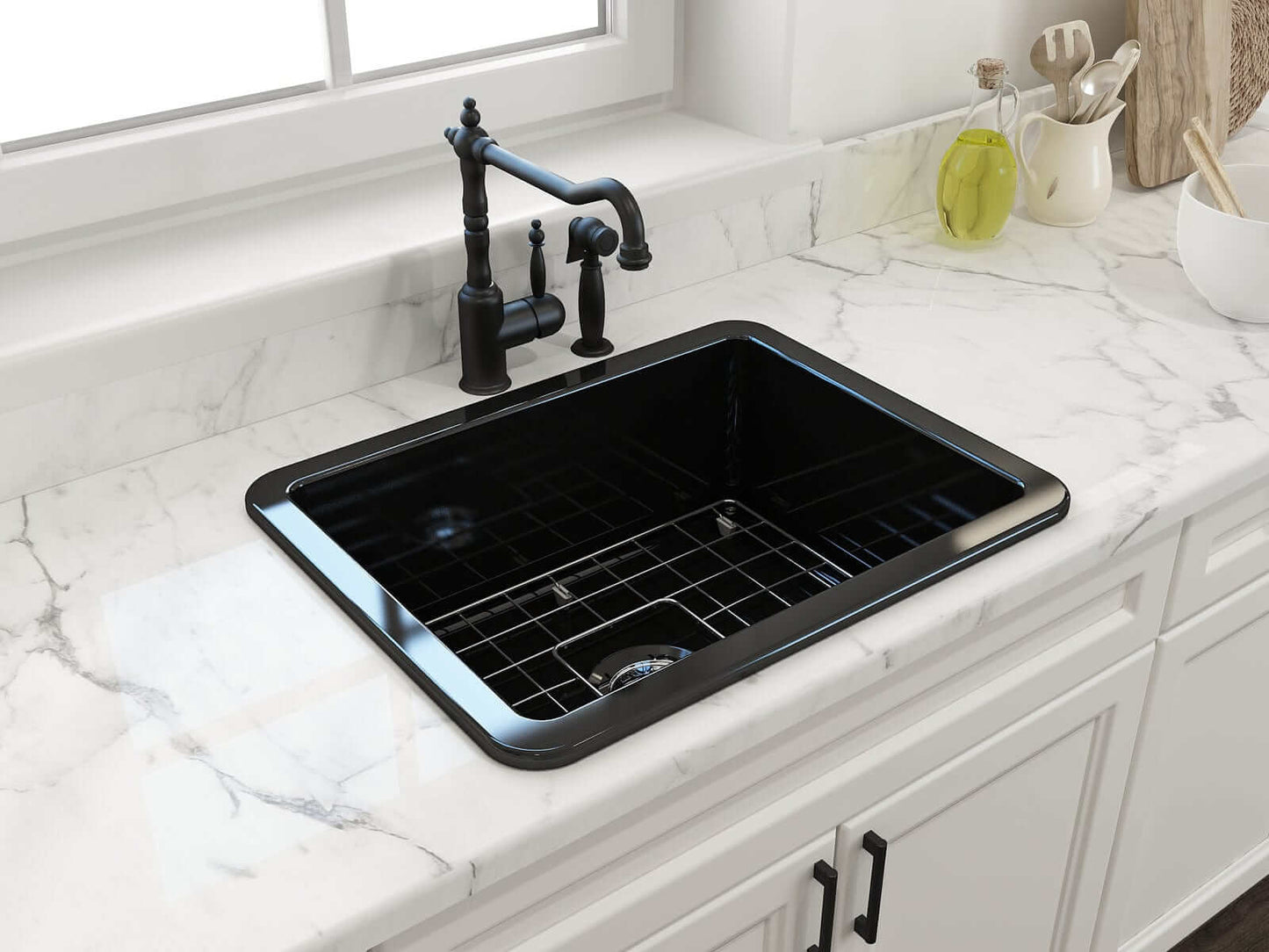 BOCCHI SOTTO 24" Fireclay Dual-Mount Single Bowl Sink with Bottom Grid & Strainer in black finish on marble countertop.