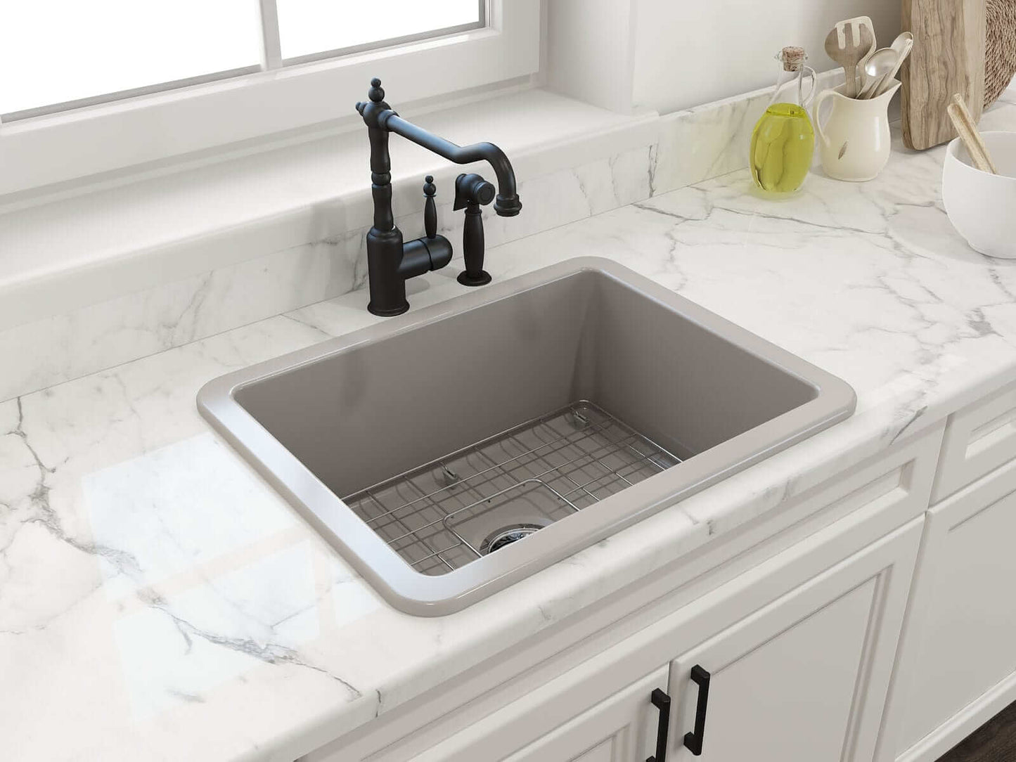 BOCCHI SOTTO 24" Fireclay Dual-Mount Single Bowl Sink with Bottom Grid & Strainer in elegant kitchen setting with marble countertop.