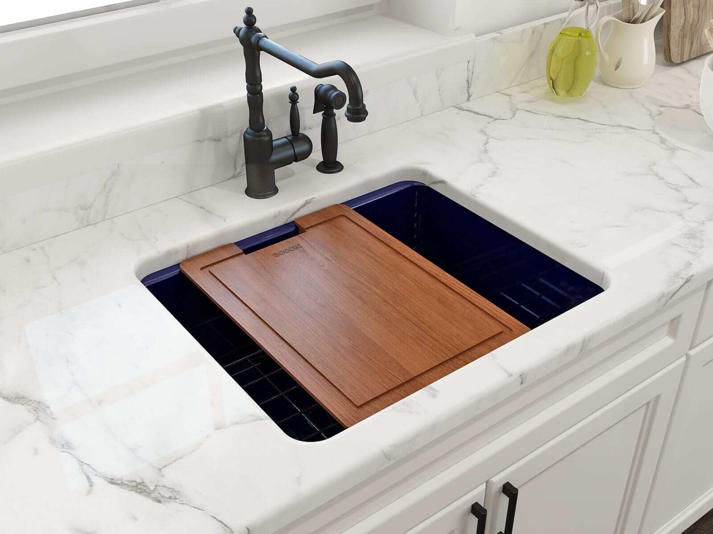 BOCCHI SOTTO 24" Fireclay Dual-Mount Single Bowl Sink with Bottom Grid & Strainer in a modern kitchen with a wooden cutting board.