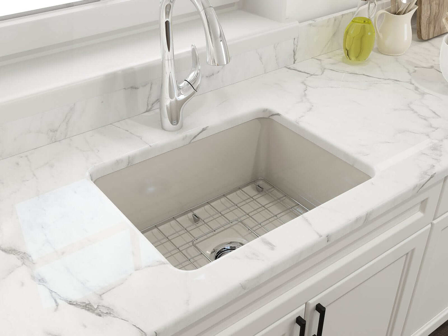 BOCCHI SOTTO 24" Fireclay Dual-Mount Single Bowl Sink with Bottom Grid & Strainer in Biscuit color against marble countertop.