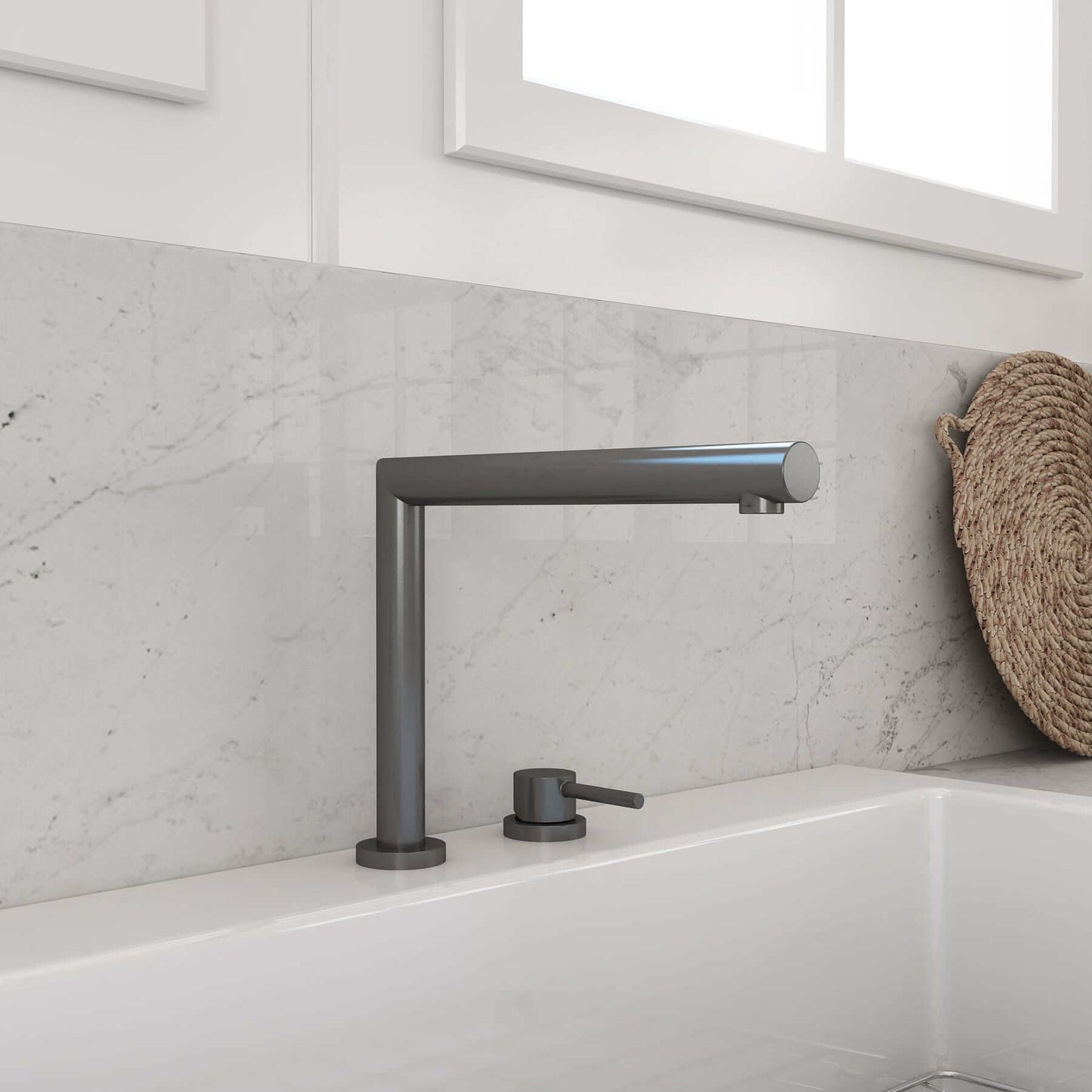 BOCCHI BAVENO Move Kitchen Faucet featuring a sleek telescopic design against a marble backdrop.