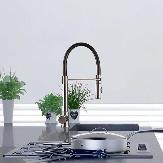 FORTIS Culinary Single Handle Pull-Down Kitchen Faucet in Brushed Nickel on modern kitchen counter with pot and plants.