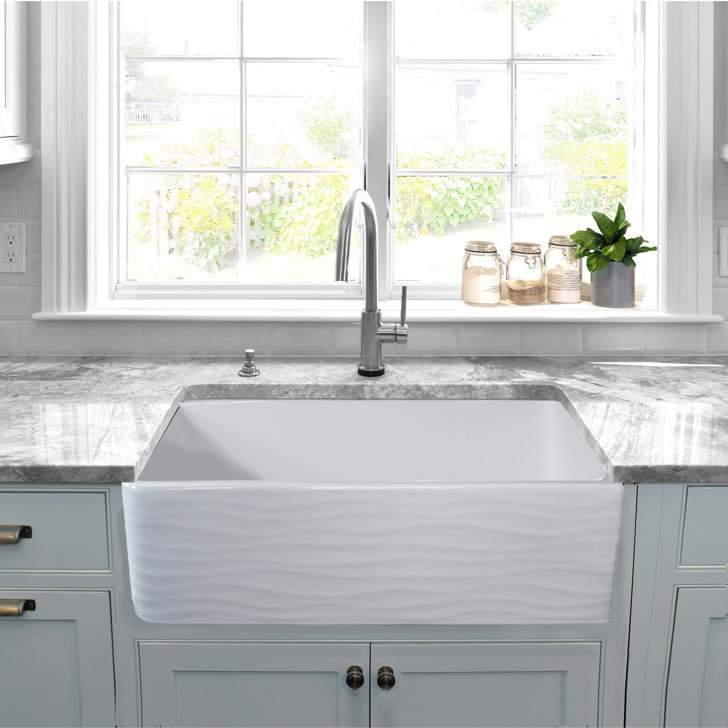 Nantucket 33" Fireclay Farmhouse with Waves - FCFS3320S-W-Waves front view in a modern kitchen setting.