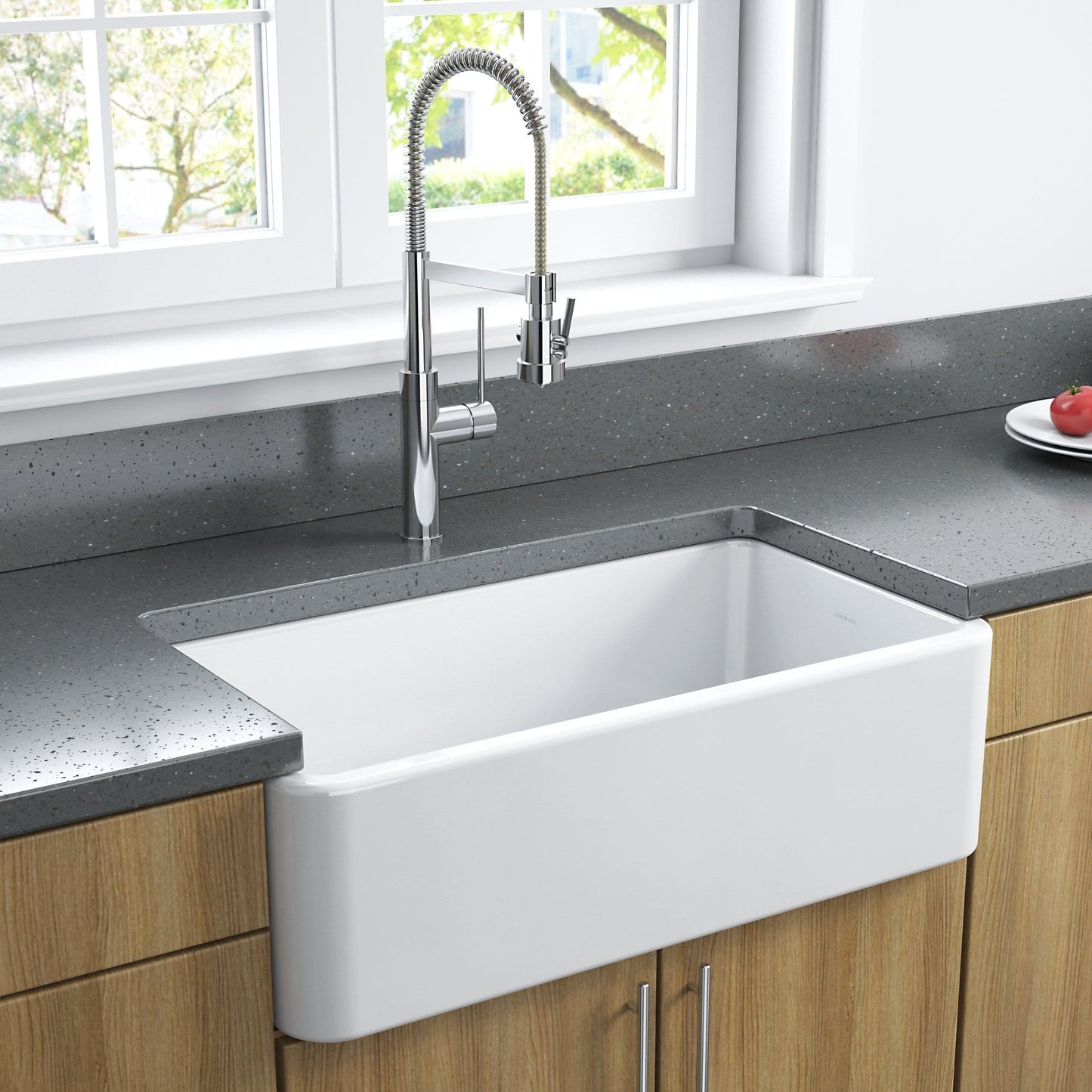 Front view of Latoscana 33" Reversible Fireclay Single Bowl Farmhouse Sink installed in modern kitchen with grey countertop.