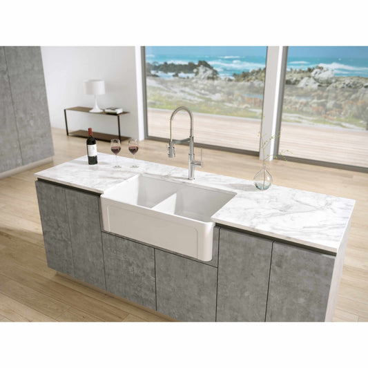 Latoscana 33" Fireclay Farmhouse Sink, 60/40 Double Bowl, White, LTD3319W front view in modern kitchen setting.