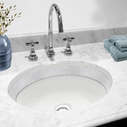 Nantucket Izola Italian Fireclay Vanity Sink - RC78340SL in a marble countertop setting with faucet and towels.