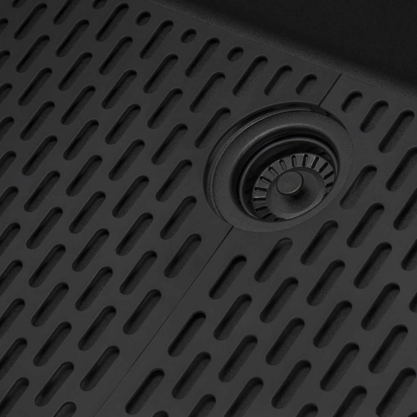 Ruvati epiStage 33" Workstation Drop-in Granite Kitchen Sink RVG1302BK detailed view of textured black surface and drain.