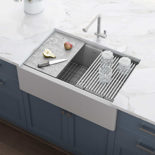 Ruvati epiCast 33" Workstation Composite Granite Kitchen Sink RVG1533GR with kitchen tools and glassware on countertop.