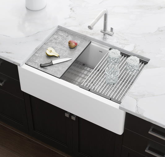 Ruvati epiCast 33" Workstation Composite Granite Kitchen Sink RVG1533WH with cutting board and glasses on countertop.