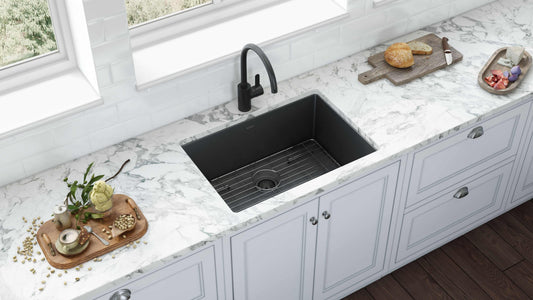 Ruvati Terraza 27" Stainless Steel Kitchen Sink RVH6127BL installed in a stylish kitchen with marble countertop.