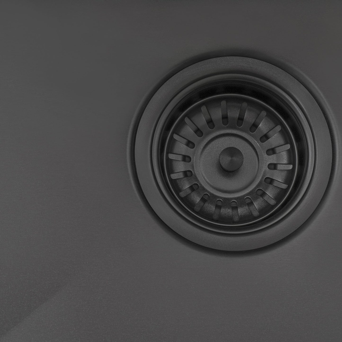 Ruvati Terraza 33" Stainless Steel Kitchen Sink RVH6433BL drain detail in Gunmetal Matte Black finish.