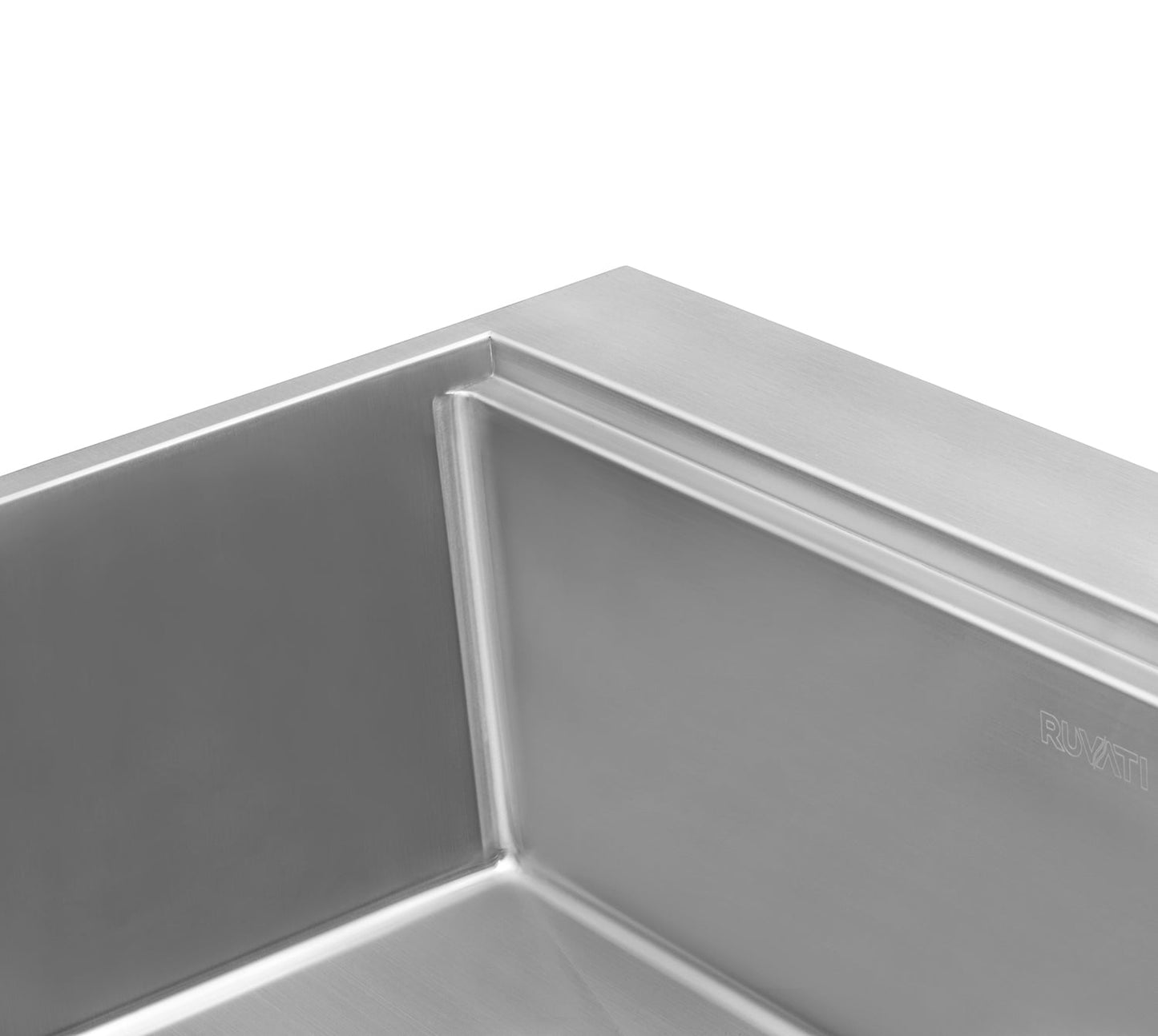 Close-up view of the Ruvati Siena 30" Workstation Drop-in Stainless Steel Kitchen Sink RVH8030's corner detail.