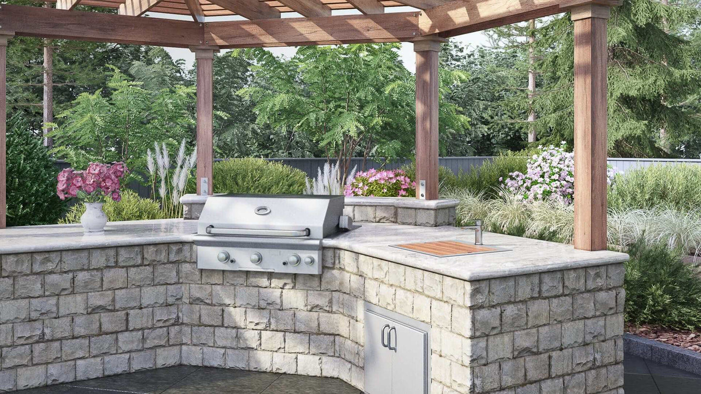 Outdoor kitchen setup with a grill, sink, and stonework in a garden setting, ideal for cooking and entertaining.