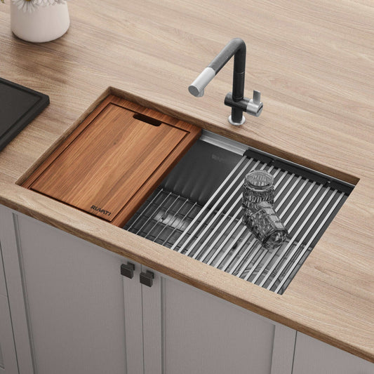 Ruvati Veniso 27" Workstation Slope Bottom Stainless Steel Kitchen Sink RVH8570 with cutting board and drying rack.
