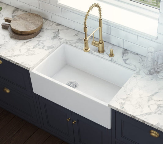 Ruvati Fiamma 30" Fireclay Kitchen Sink RVL2018WL installed in a modern kitchen with marble countertop.
