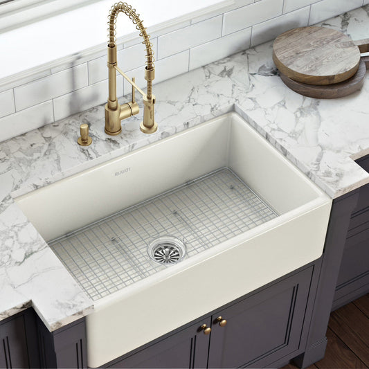 Ruvati Fiamma 30" Fireclay Reversible Single Bowl Kitchen Sink RVL2100BS in a cozy kitchen setting with brass faucet.