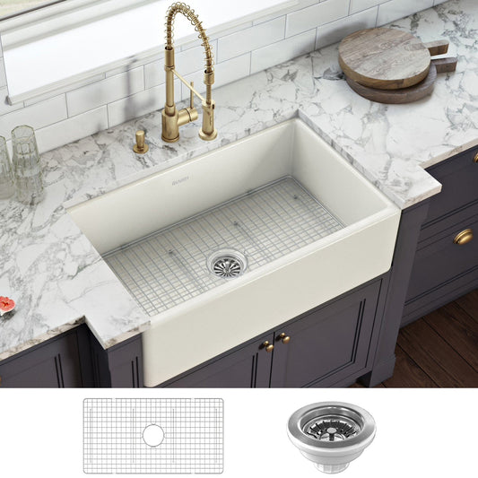 Ruvati Fiamma 33" Fireclay Reversible Single Bowl Kitchen Sink RVL2300BS in warm biscuit finish on marble countertop.