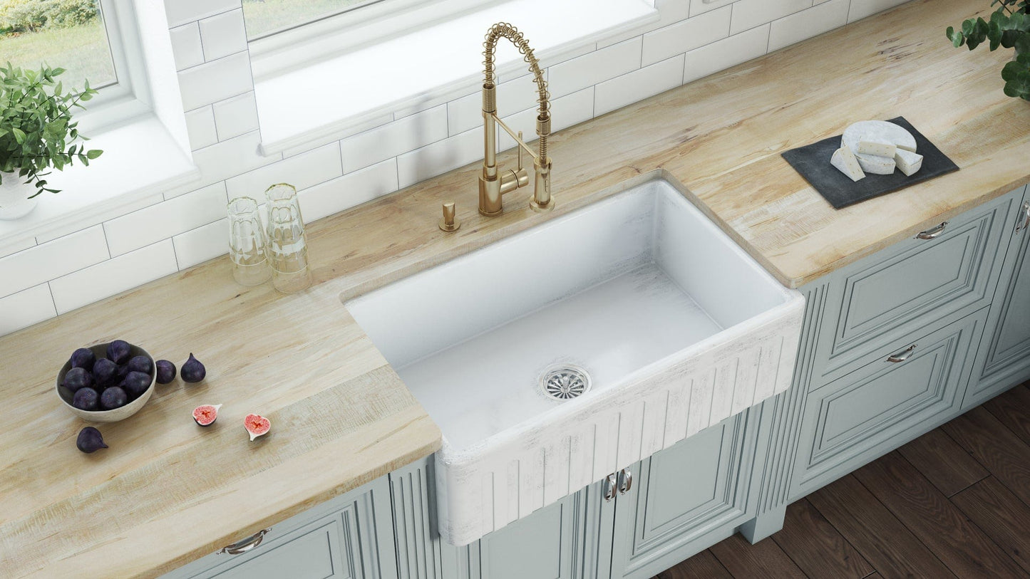 Ruvati Fiamma 33" Fireclay Reversible Kitchen Sink RVL2300SW displayed in a vintage beach house kitchen.