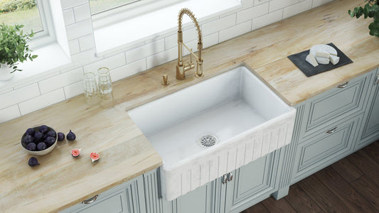 Ruvati Fiamma 33" Fireclay Reversible Kitchen Sink RVL2300SW displayed in a vintage beach house kitchen.