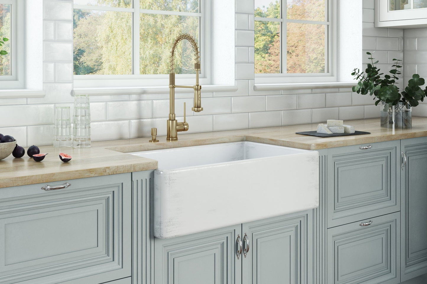 Ruvati Fiamma 33" Fireclay Reversible Kitchen Sink RVL2300SW showcased in a stylish coastal kitchen setting.
