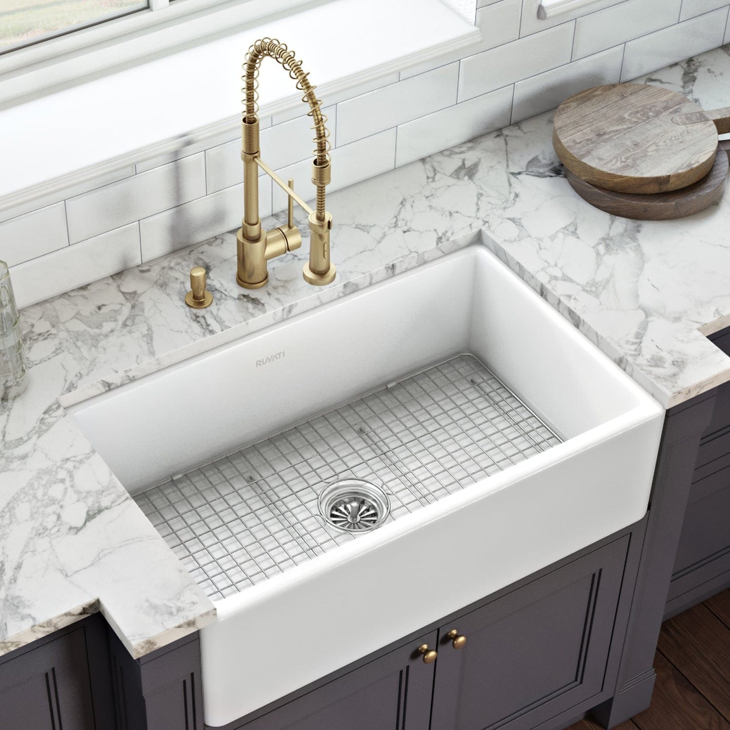 Ruvati Fiamma 33" Fireclay Kitchen Sink RVL2300WH with classic design and modern faucet in a stylish kitchen.