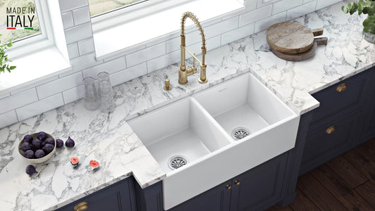 Ruvati Fiamma 33" Fireclay Double Bowl Kitchen Sink RVL2311WH in a modern kitchen setting with stylish faucet.