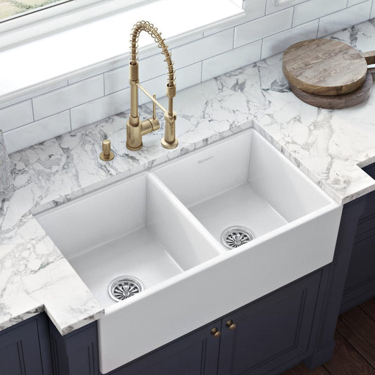 Ruvati Fiamma 33" Fireclay Double Bowl Kitchen Sink RVL2311WH with elegant kitchen faucet and marble countertop.