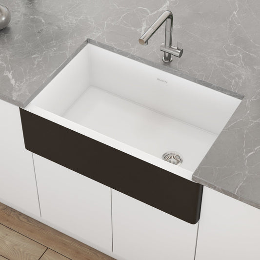 Ruvati Fiamma 30" Offset Drain Fireclay Kitchen Sink RVL4018RBW with a sleek design on a marble countertop.