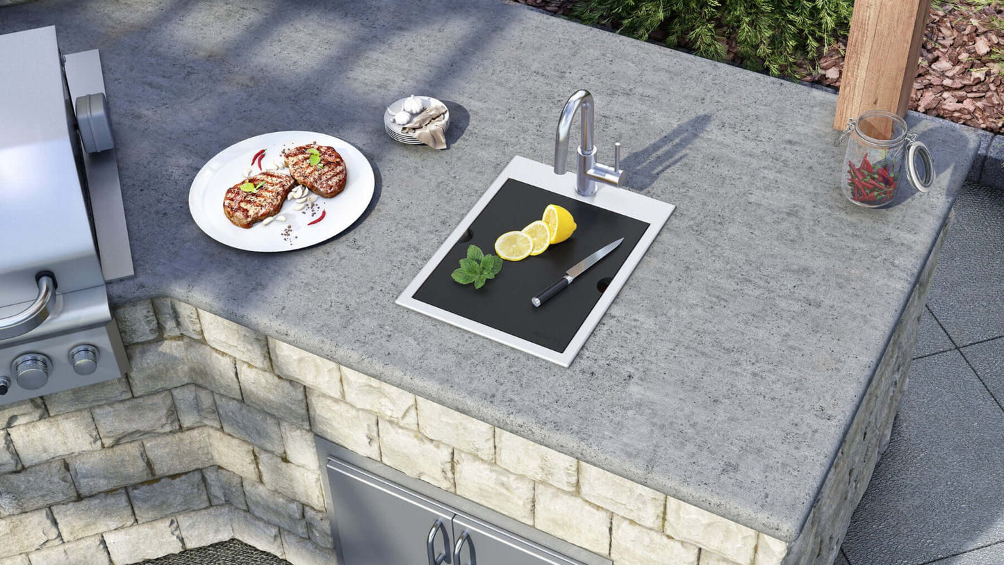 Ruvati Merino 15" Marine Grade Workstation RV Boat Outdoor Sink RVQ5210 on outdoor kitchen countertop with food preparation.
