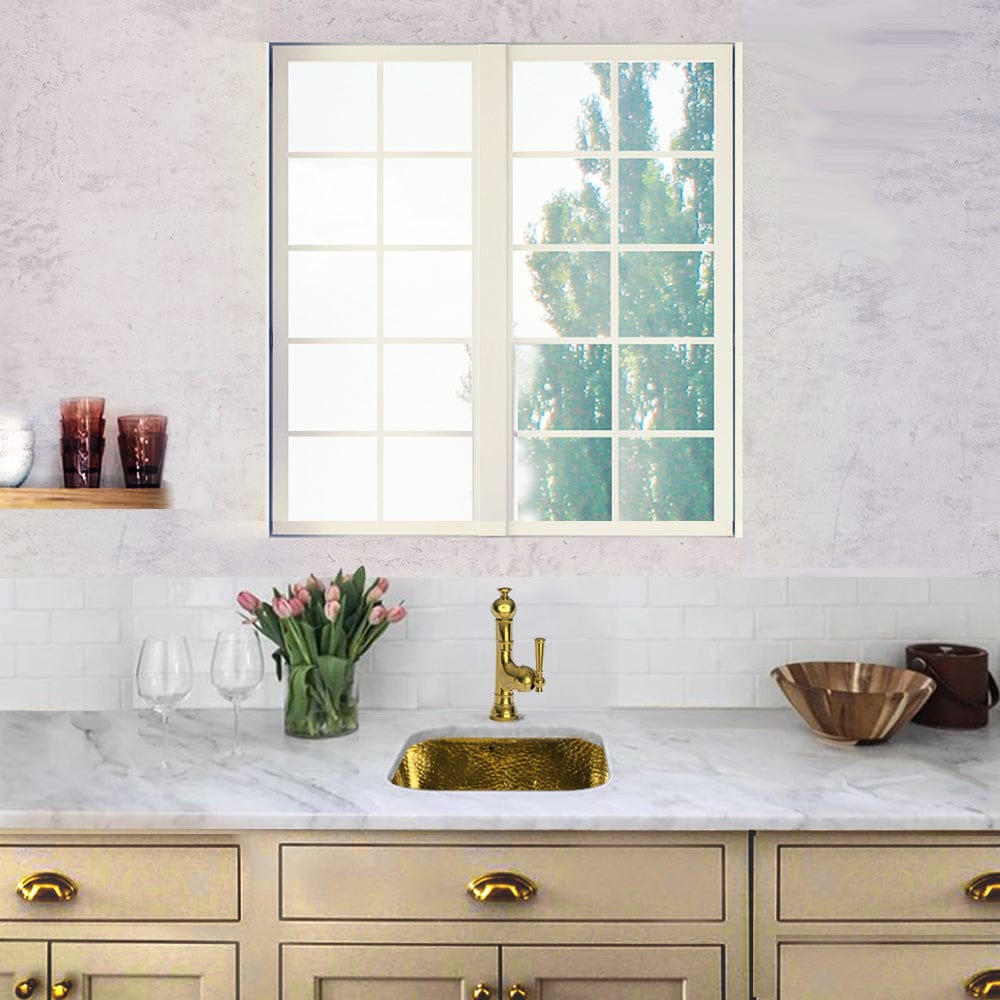 Nantucket 16.625" Hand-Hammered Brass Bar Sink SQRB-7 in a stylish kitchen setting with a window.