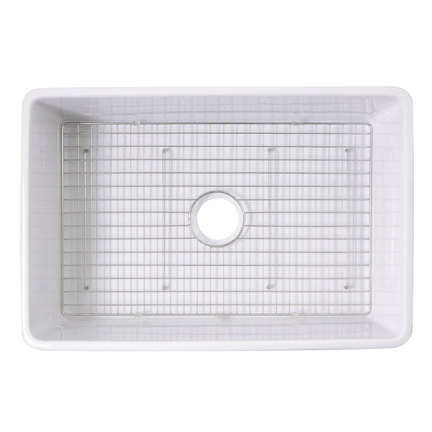 Nantucket Stainless Steel Bottom Grid - BG-VC30S installed in a white fireclay sink, designed for optimal drainage and protection.