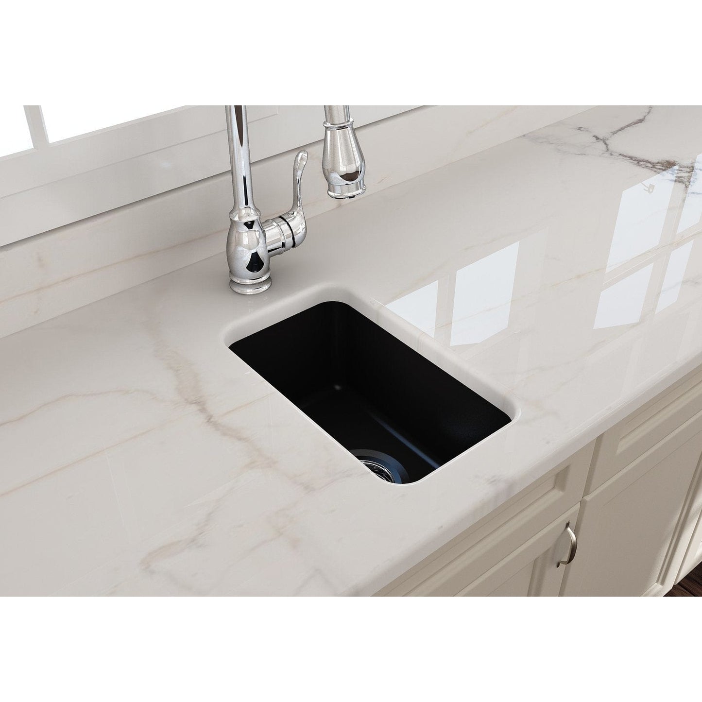 Top view of BOCCHI SOTTO 12" Fireclay Modern Undermount Single Bowl Bar Sink with Strainer on marble countertop.