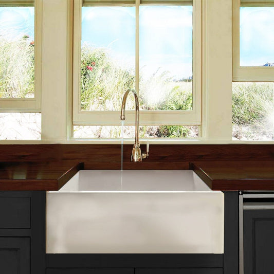 Nantucket 24" Farmhouse Apron Sink - Hyannis-24 showcased in a bright kitchen with large windows.