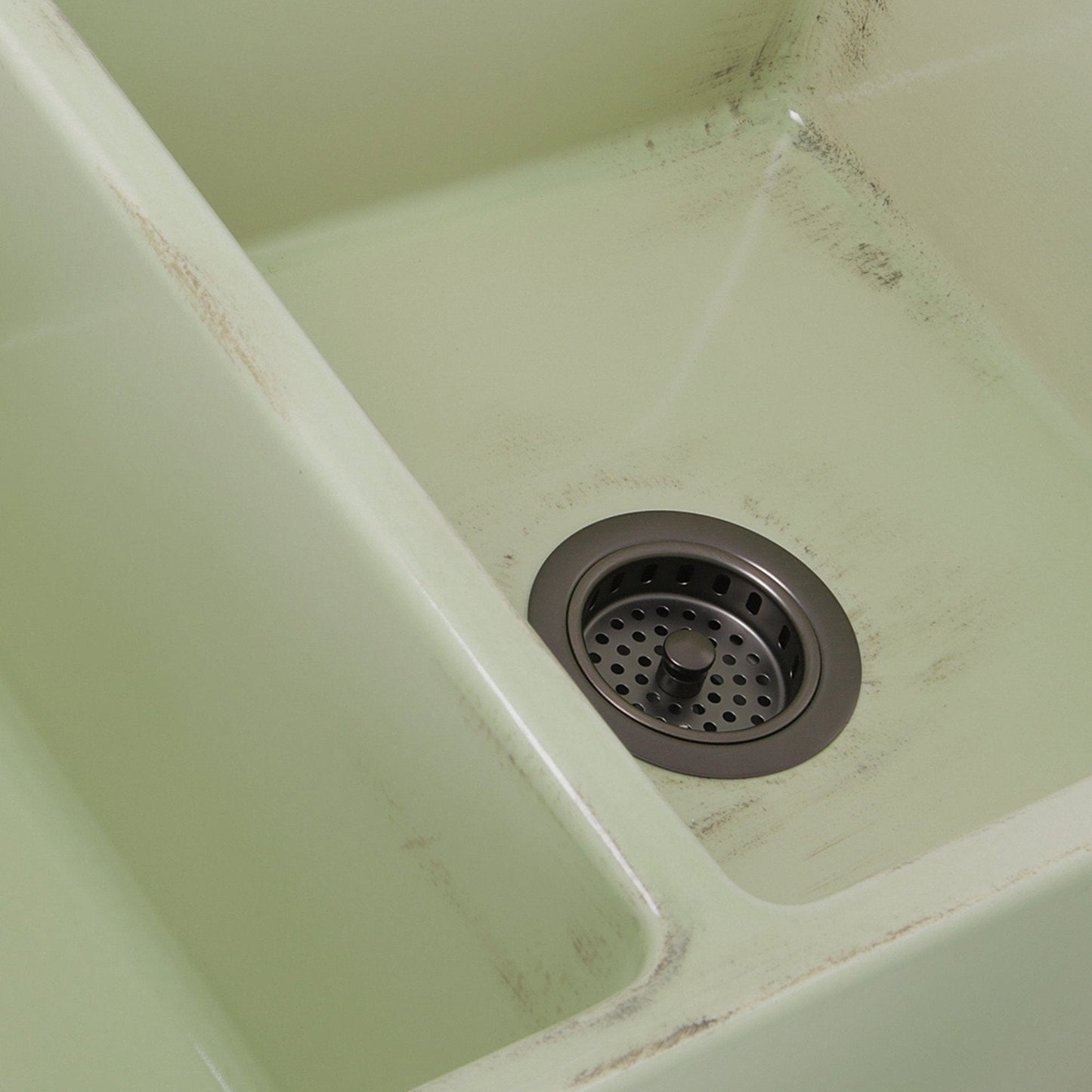 Nantucket 33" Double Bowl Farmhouse Fireclay Sink with Shabby Green Finish - FCFS3318D-ShabbyGreen close-up of drain