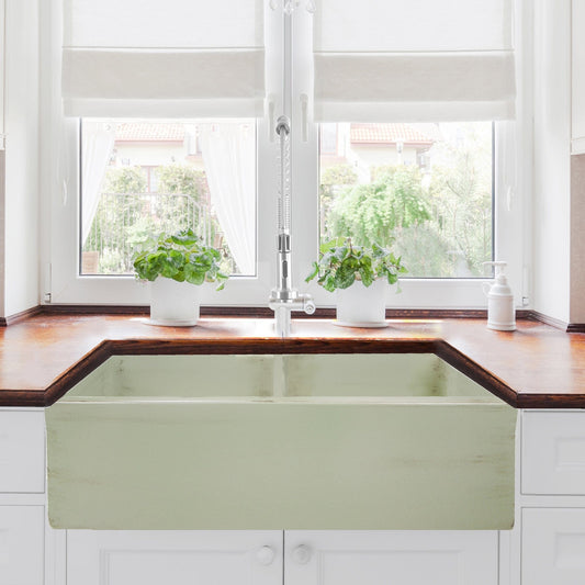 Nantucket 33" Double Bowl Farmhouse Fireclay Sink with Shabby Green Finish - FCFS3318D-ShabbyGreen displayed in a kitchen.