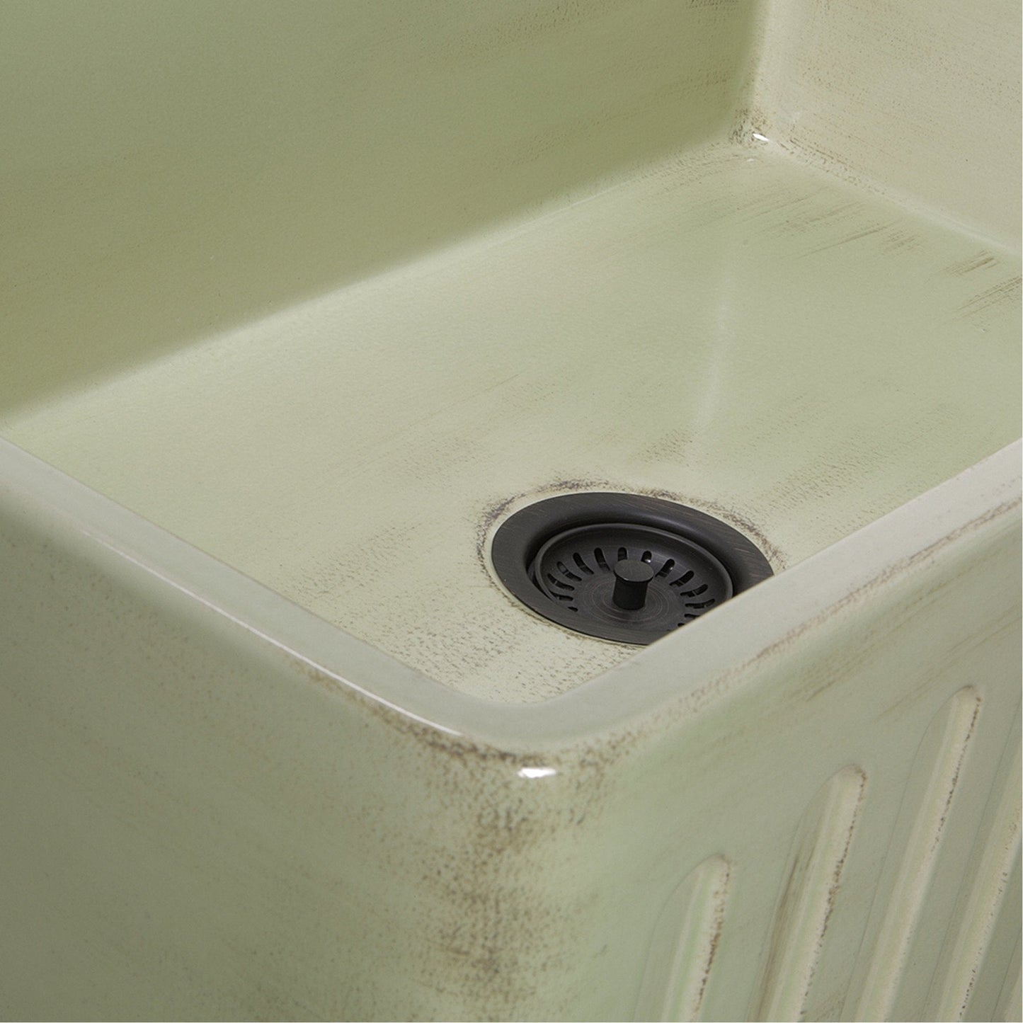 Nantucket 33" Farmhouse Fireclay Sink with Shabby Green Finish - FCFS3320S-ShabbyGreen close-up view of sink basin and drain.