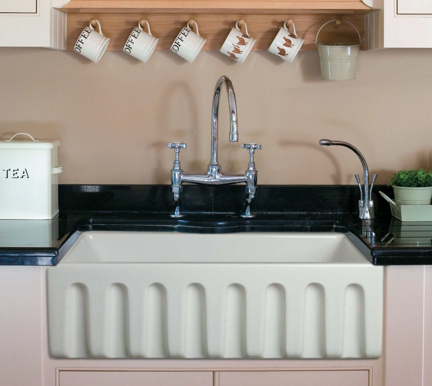 ALFI 30" White Reversible Fireclay Farmhouse Sink with modern faucet in a stylish kitchen setting.